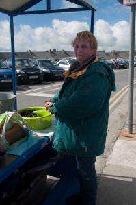Woman selling periwinkles in Kilkee